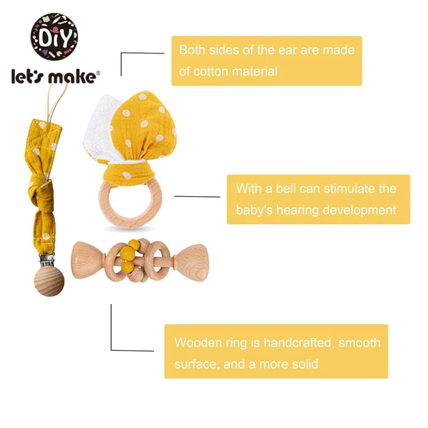 Baby Gift Set - baby teether with bunny ears made of cotton material and wooden toy that has a bell. It comes with a bell that can stimulate the baby's hearing development. The toy with wooden ring is handcrafted, smooth surface
